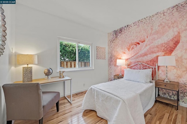 bedroom with light hardwood / wood-style flooring