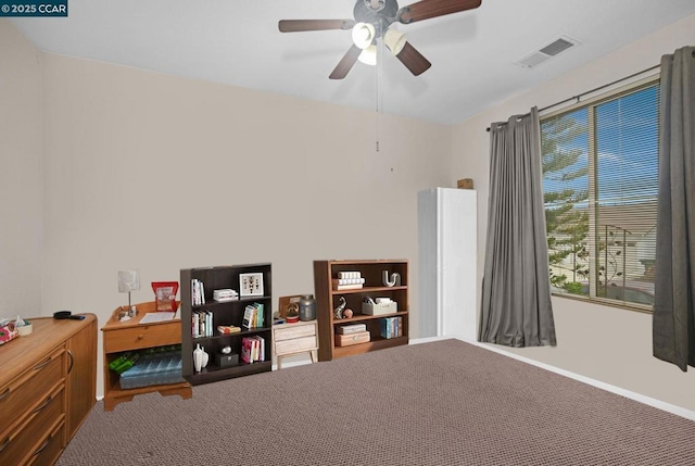 interior space with ceiling fan