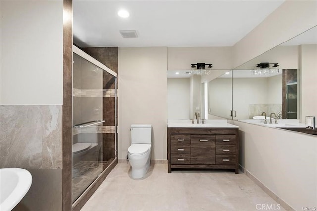 full bathroom featuring vanity, shower with separate bathtub, and toilet