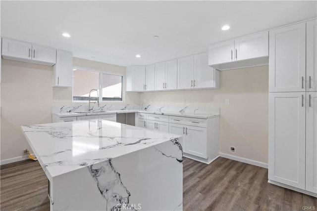 kitchen featuring white cabinetry and a kitchen island