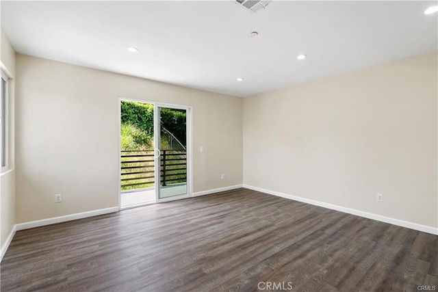 empty room featuring dark hardwood / wood-style floors