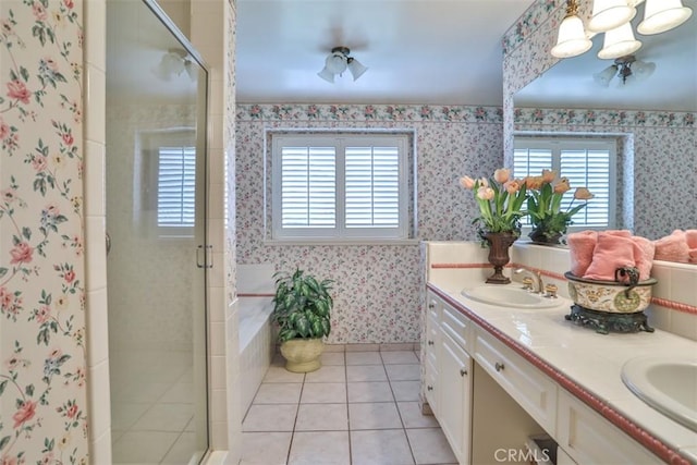 bathroom featuring a wealth of natural light, a shower with door, and tile patterned flooring