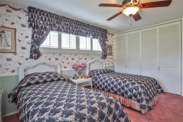 carpeted bedroom with a closet and ceiling fan