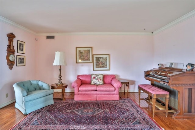 living room with crown molding and wood-type flooring