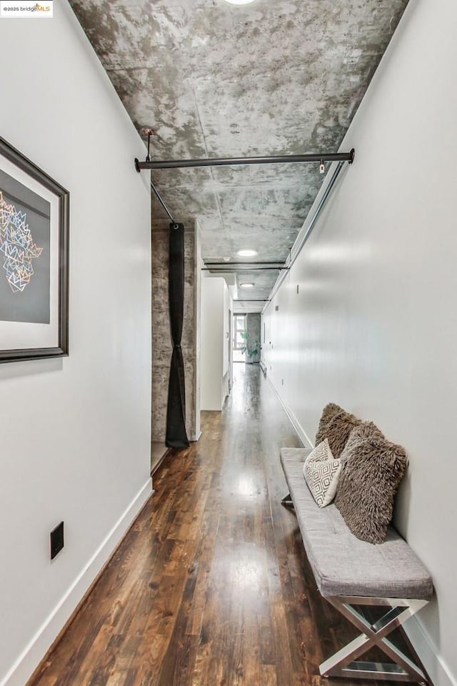 corridor with dark wood-type flooring