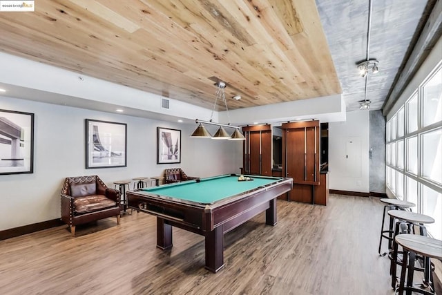 game room with wood ceiling, hardwood / wood-style flooring, billiards, and a barn door