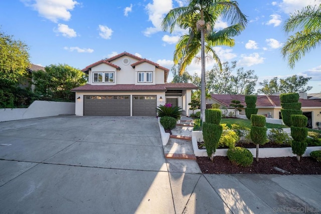 mediterranean / spanish house with a garage