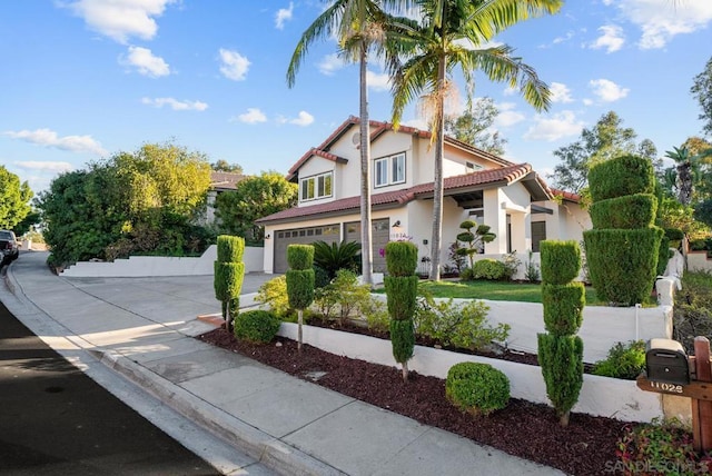 mediterranean / spanish-style home featuring a garage