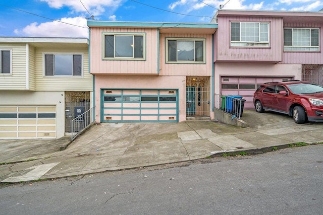 townhome / multi-family property featuring a garage