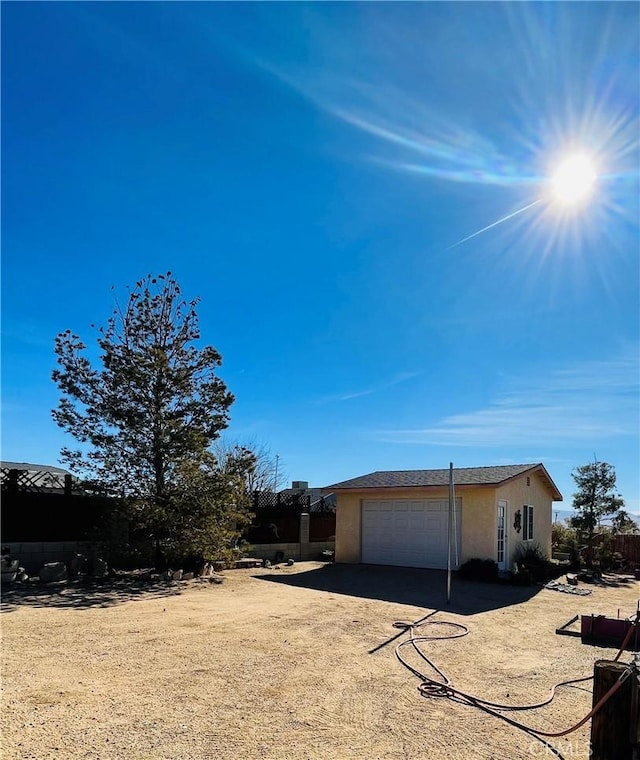 view of side of property with a garage