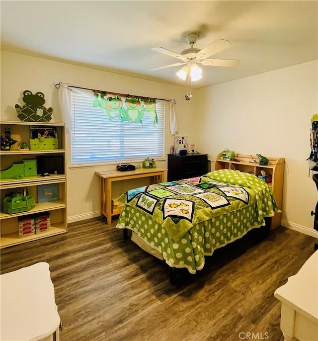 bedroom featuring ceiling fan and dark wood-type flooring