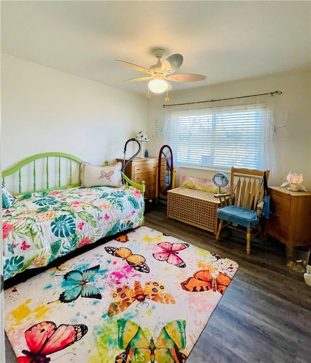 bedroom with ceiling fan and dark hardwood / wood-style flooring