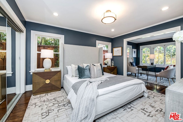 bedroom featuring hardwood / wood-style flooring and ornamental molding