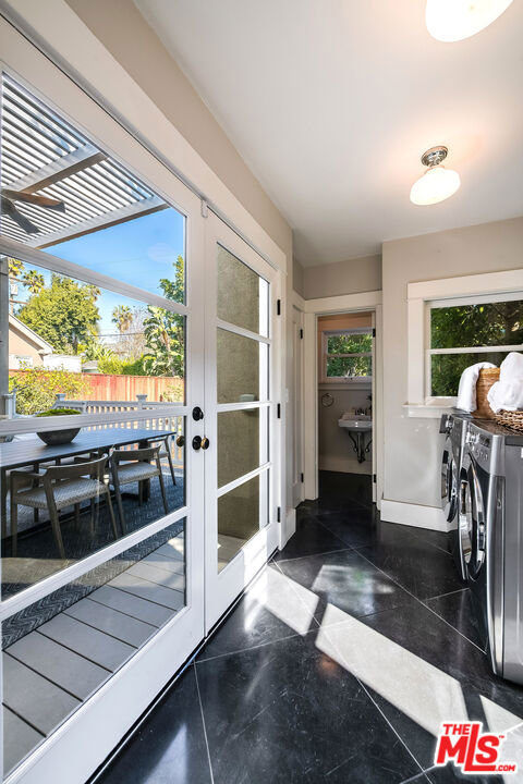 doorway featuring french doors and washer and dryer