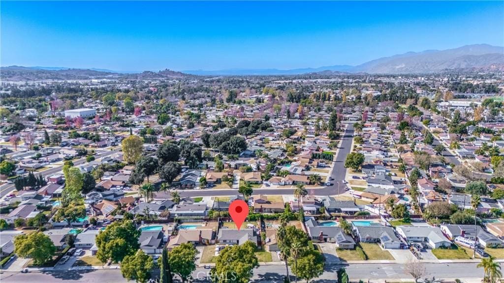 birds eye view of property with a mountain view