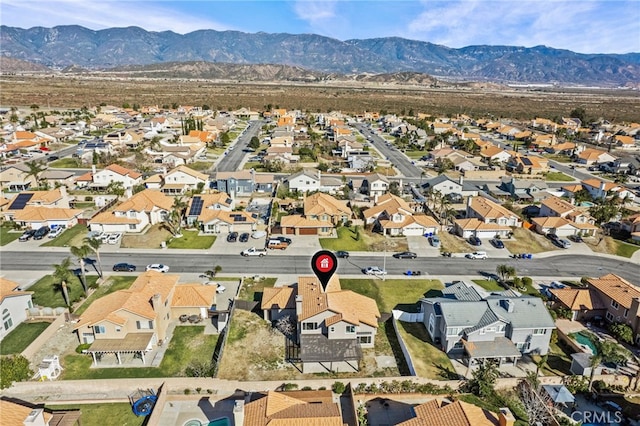 drone / aerial view with a residential view and a mountain view