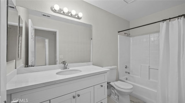 full bathroom featuring shower / bathtub combination with curtain, vanity, a textured ceiling, and toilet