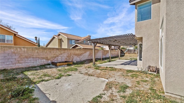 view of yard with a patio area and a pergola