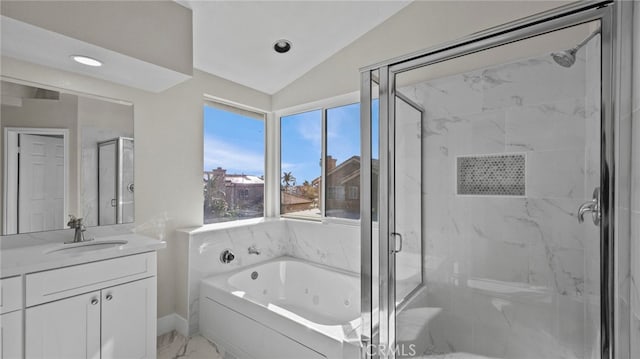 bathroom featuring lofted ceiling, vanity, and shower with separate bathtub