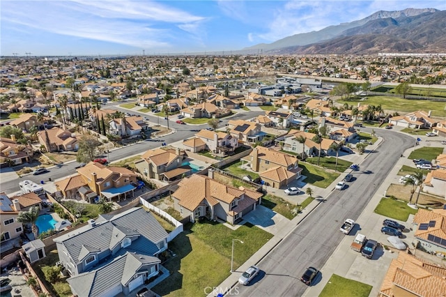 drone / aerial view featuring a residential view and a mountain view