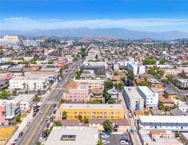 birds eye view of property with a mountain view