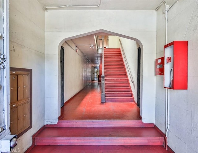 stairs featuring a towering ceiling