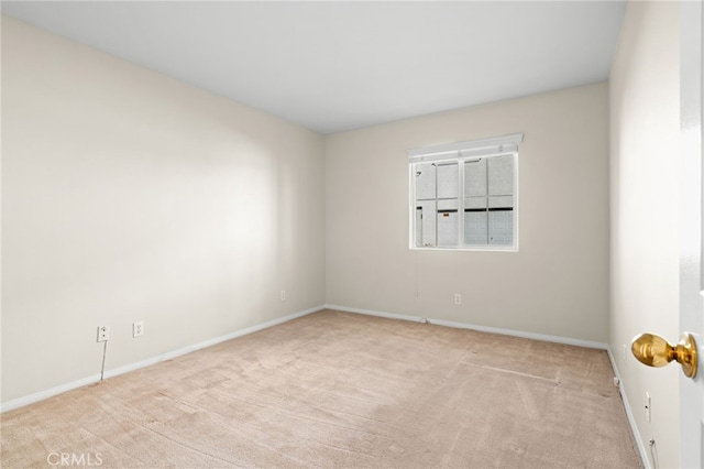 unfurnished room with light carpet