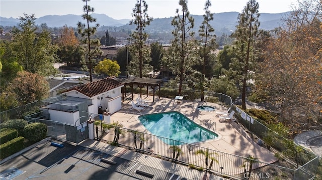 birds eye view of property with a mountain view