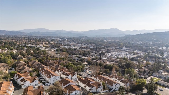 birds eye view of property with a mountain view