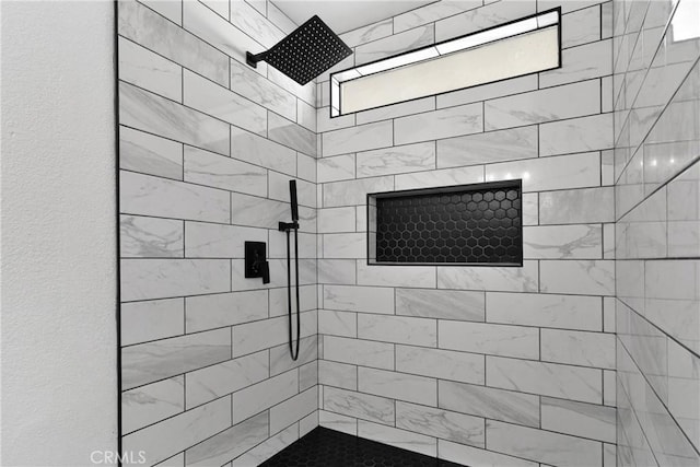 bathroom featuring tiled shower