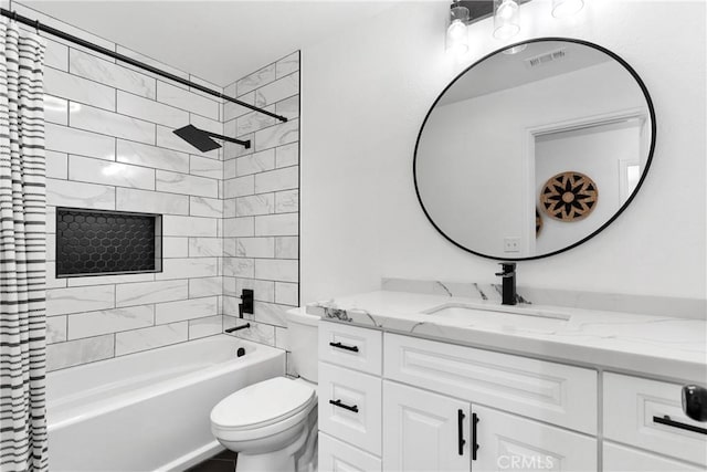 full bathroom with toilet, vanity, and shower / tub combo