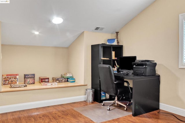 office area featuring hardwood / wood-style flooring and lofted ceiling