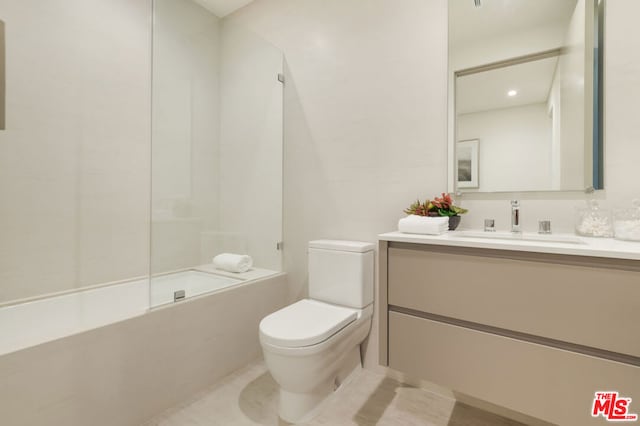 full bathroom with toilet, vanity, and shower / washtub combination