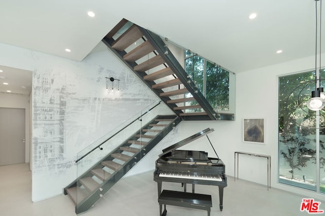 stairs with concrete floors