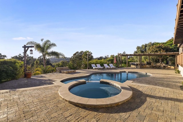 view of pool featuring an in ground hot tub and a patio