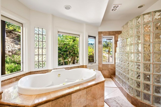 bathroom with tile patterned floors and walk in shower