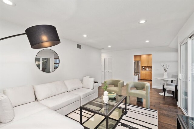 living room featuring dark hardwood / wood-style flooring