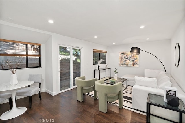 living room with baseboards, wood finished floors, and recessed lighting