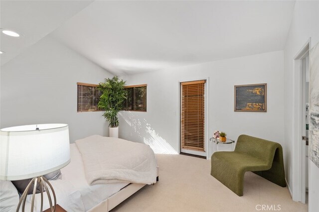 carpeted bedroom featuring vaulted ceiling