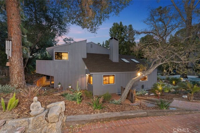 view of property exterior at dusk