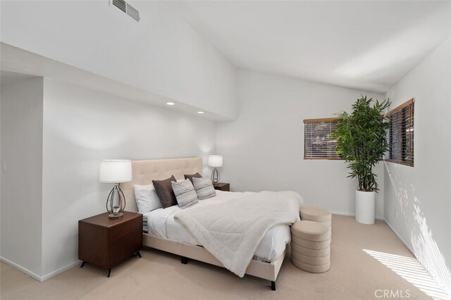 bedroom featuring carpet floors, visible vents, vaulted ceiling, and baseboards