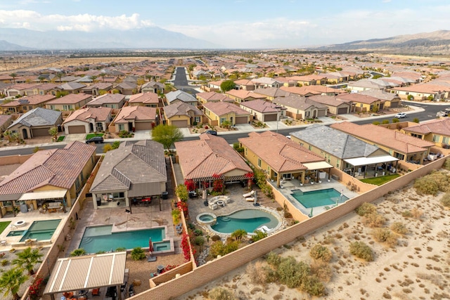 drone / aerial view featuring a mountain view