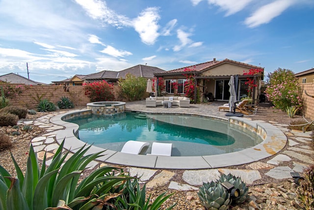 view of pool with an in ground hot tub and a patio