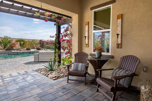 view of patio with a fenced in pool