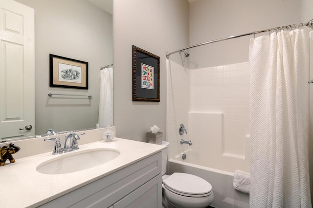 full bathroom with vanity, shower / bath combination with curtain, and toilet