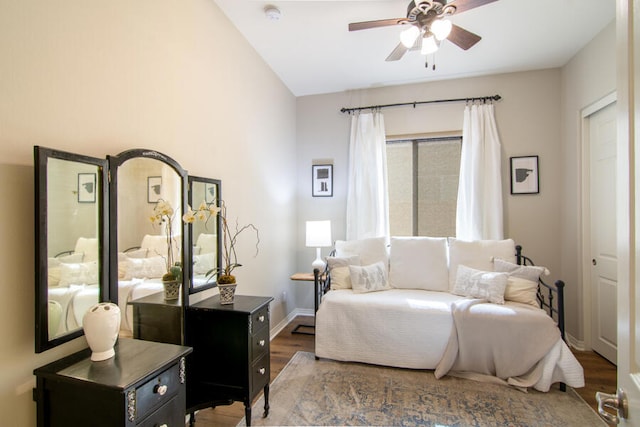 bedroom with ceiling fan and dark hardwood / wood-style flooring