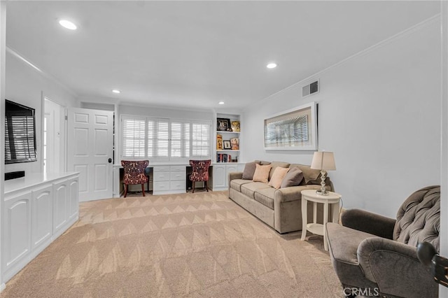 living room featuring built in features, ornamental molding, and light carpet