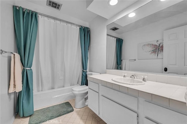 full bathroom featuring shower / bathtub combination with curtain, vanity, toilet, and tile patterned floors