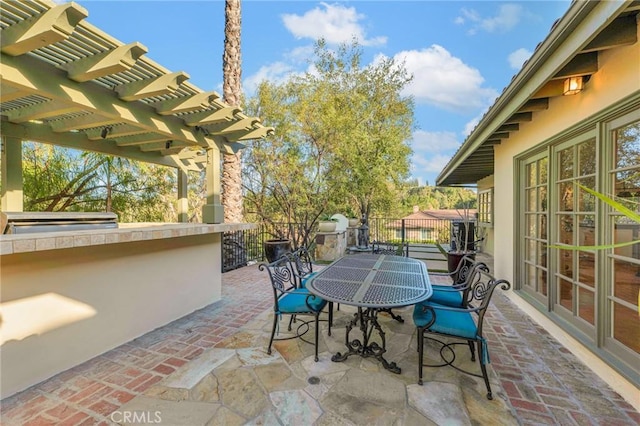 view of patio / terrace featuring exterior bar and a pergola