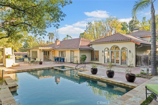 back of house with a patio and french doors